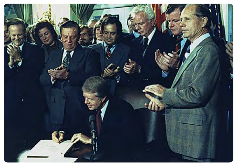 President Jimmy Carter signs the Airline Deregulation Act in late 1978.
