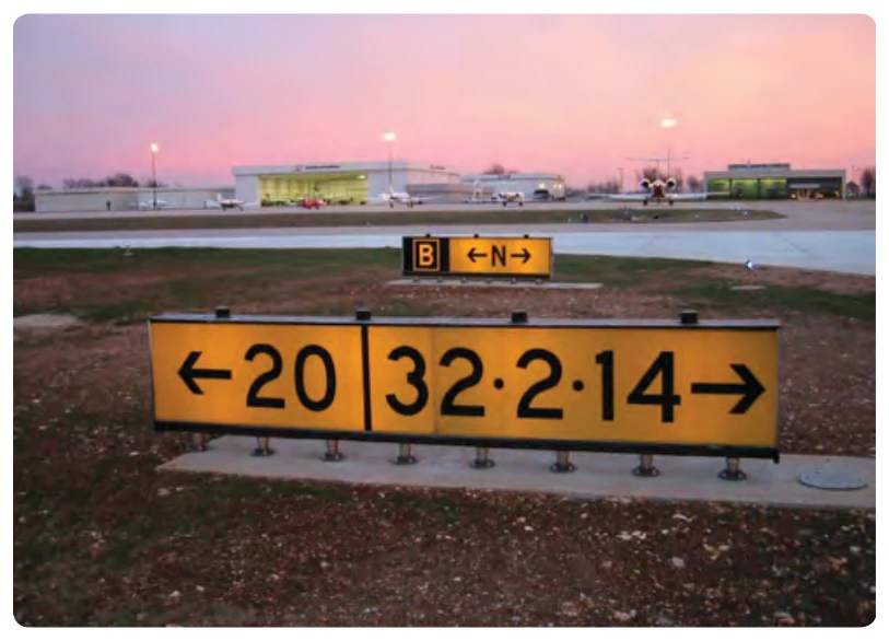 Runway destination sign with different taxi routes.