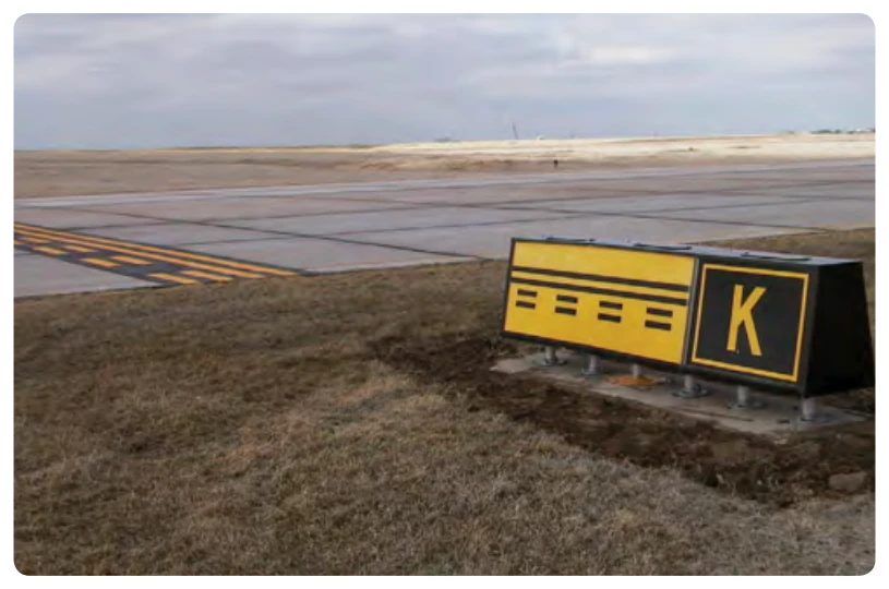 Runway safety area boundary sign and marking located on Taxiway Kilo.