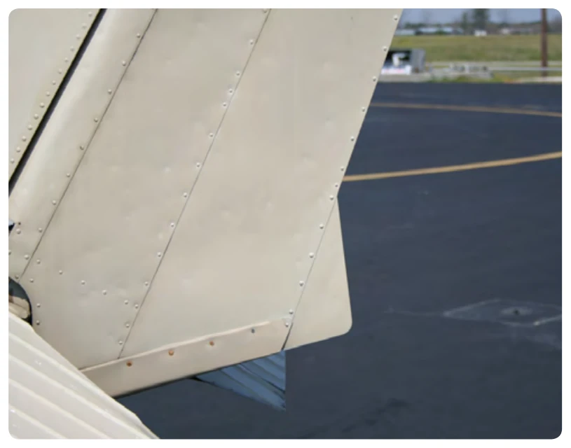 A ground adjustable tab is used on the rudder of many small airplanes to correct for a tendency to fly with the fuselage slightly misaligned with the relative wind.